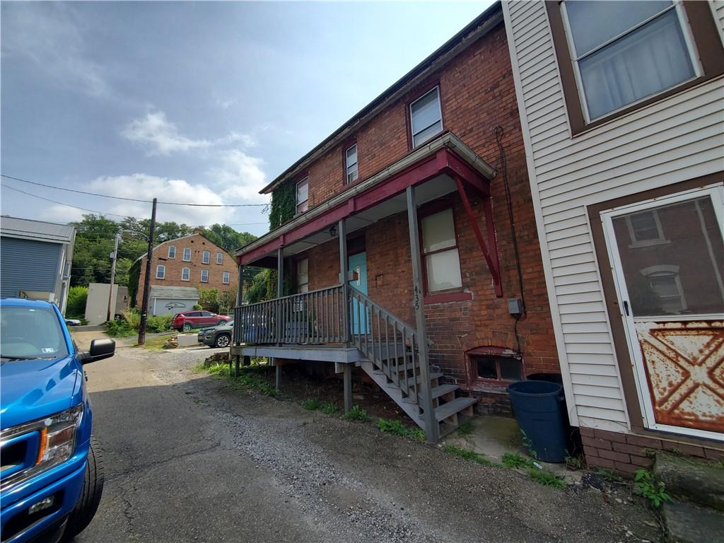 435 1/2 Reesman Drive, Unit 2 Kittanning, PA 16201 - Photo 2 of 14 a view of house with chair and tables