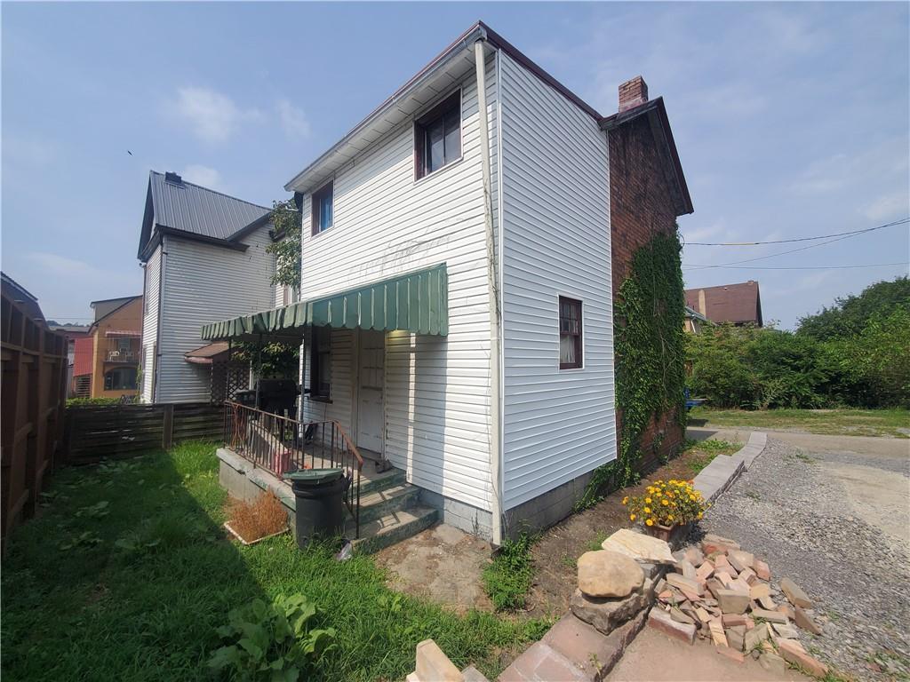 435 1/2 Reesman Drive, Unit 2 Kittanning, PA 16201 - Photo 4 of 14 a front view of a house with garden