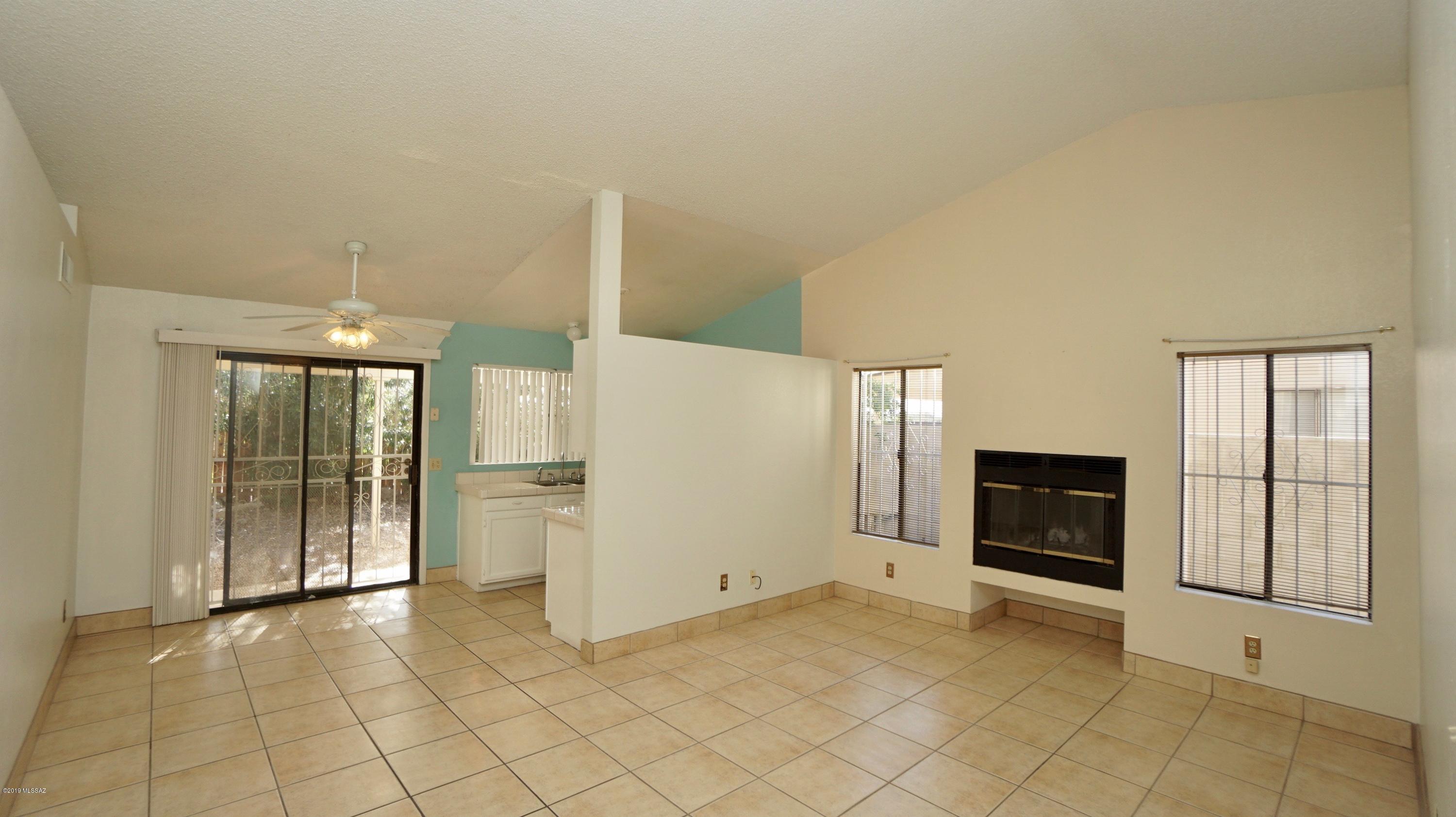 4796 South Lincoln Ridge Drive Tucson, AZ 85730 - Photo 2 of 12 a view of an empty room and window