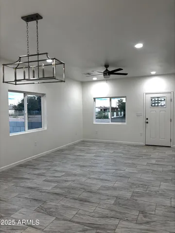 a view of an empty room with a window