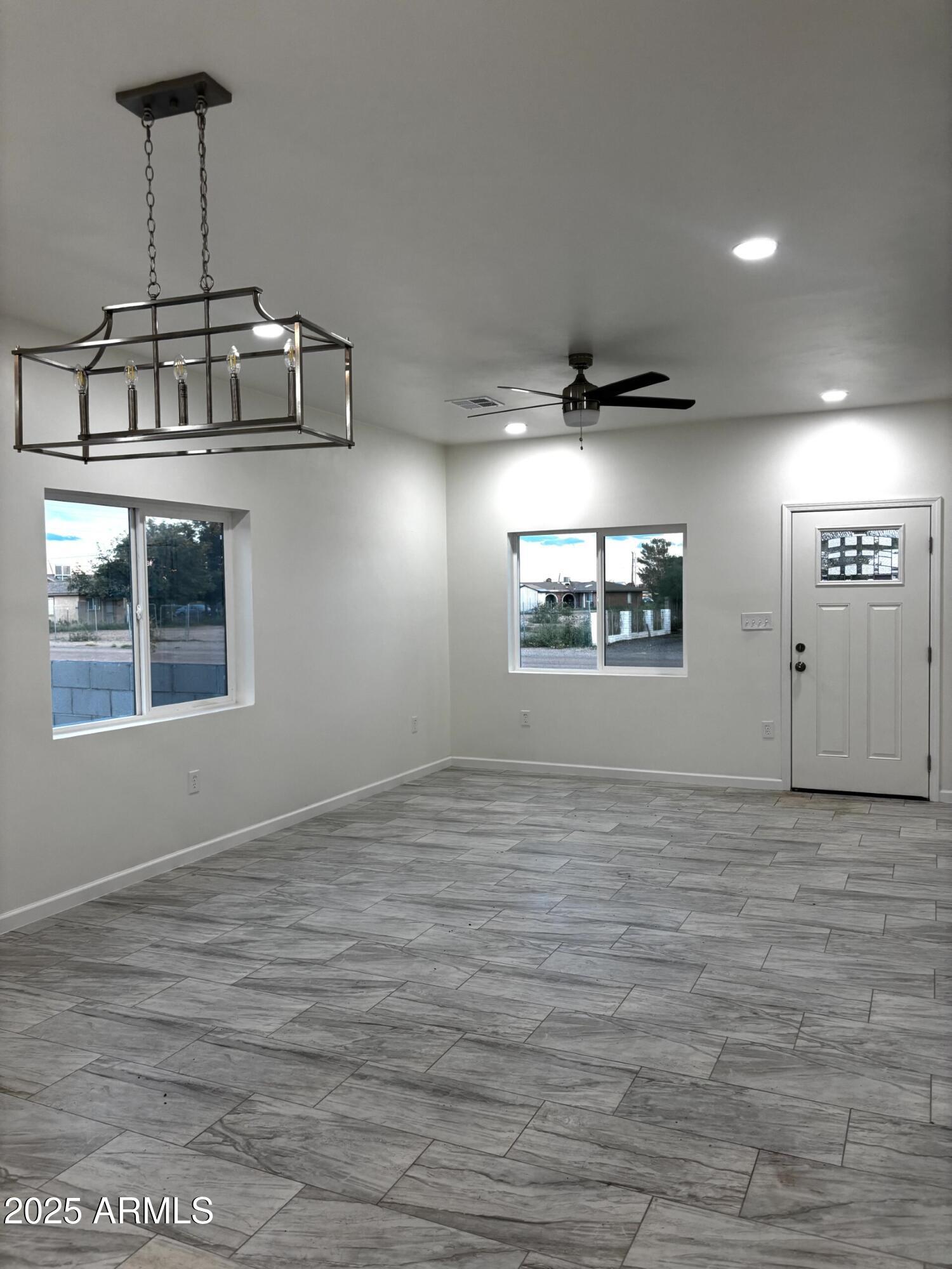 486 Anderson Avenue Douglas, AZ 85607 - Photo 5 of 16 a view of an empty room with a window