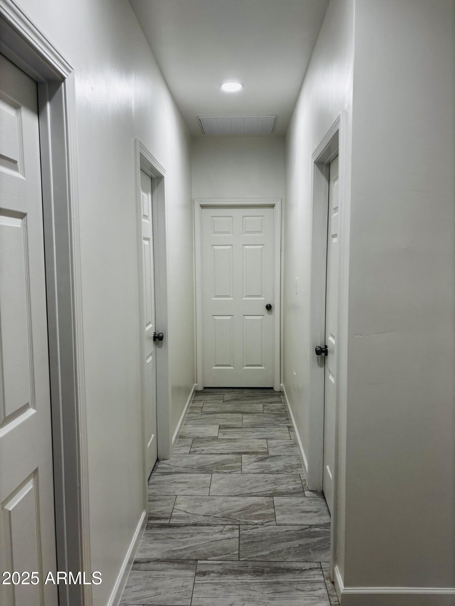 486 Anderson Avenue Douglas, AZ 85607 - Photo 8 of 16 a view of a hallway with wooden floor