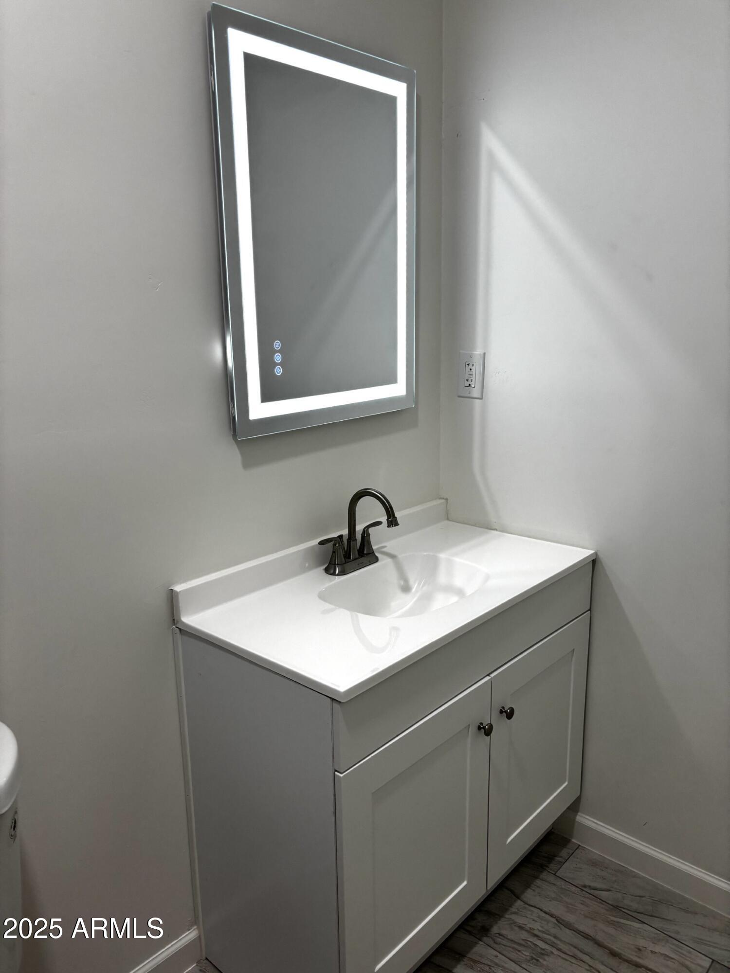 486 Anderson Avenue Douglas, AZ 85607 - Photo 9 of 16 a bathroom with a sink and a mirror