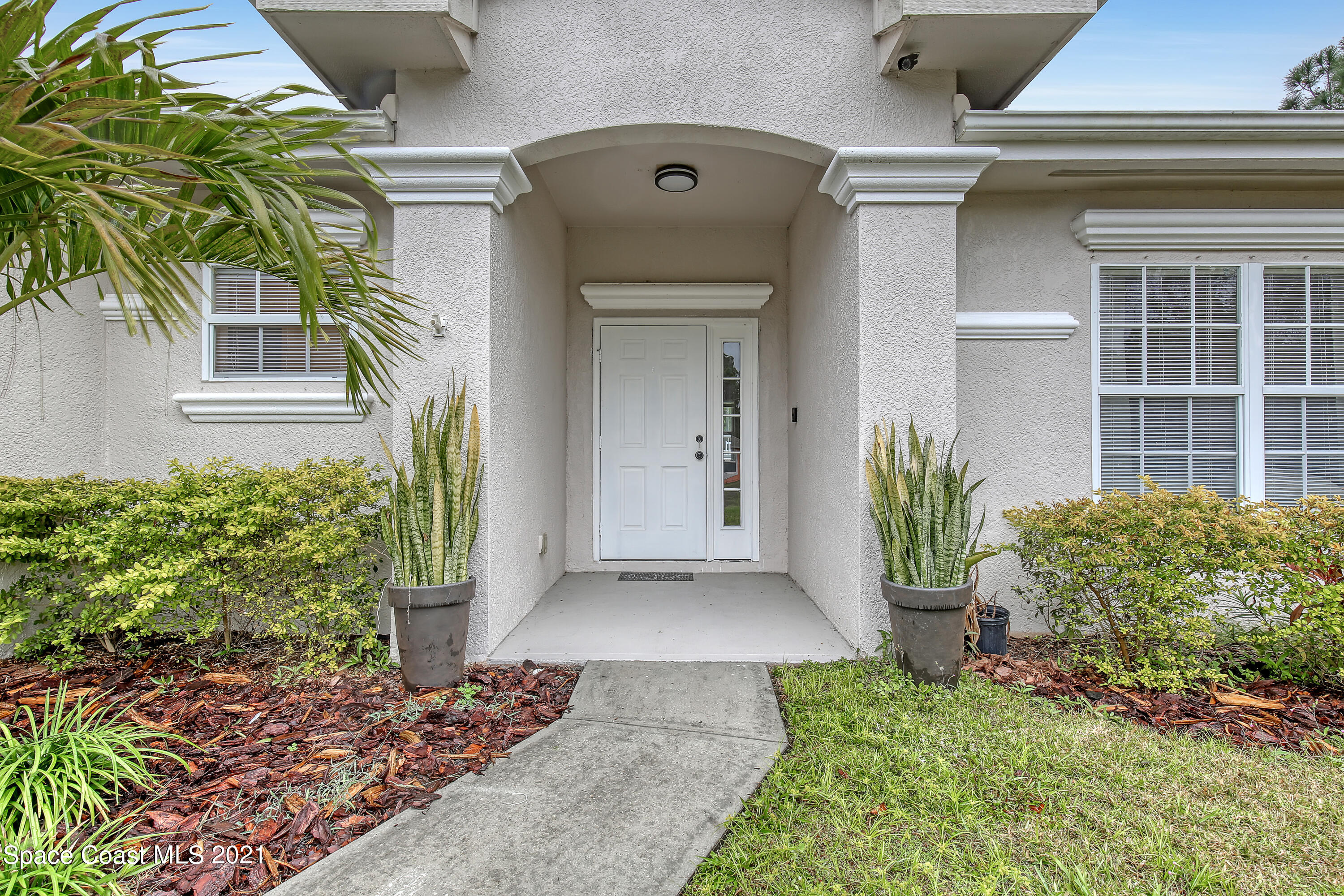 1277 Harlingen Road Southwest Palm Bay, FL 32908 - Photo 2 of 32 a view of a entryway door of the house