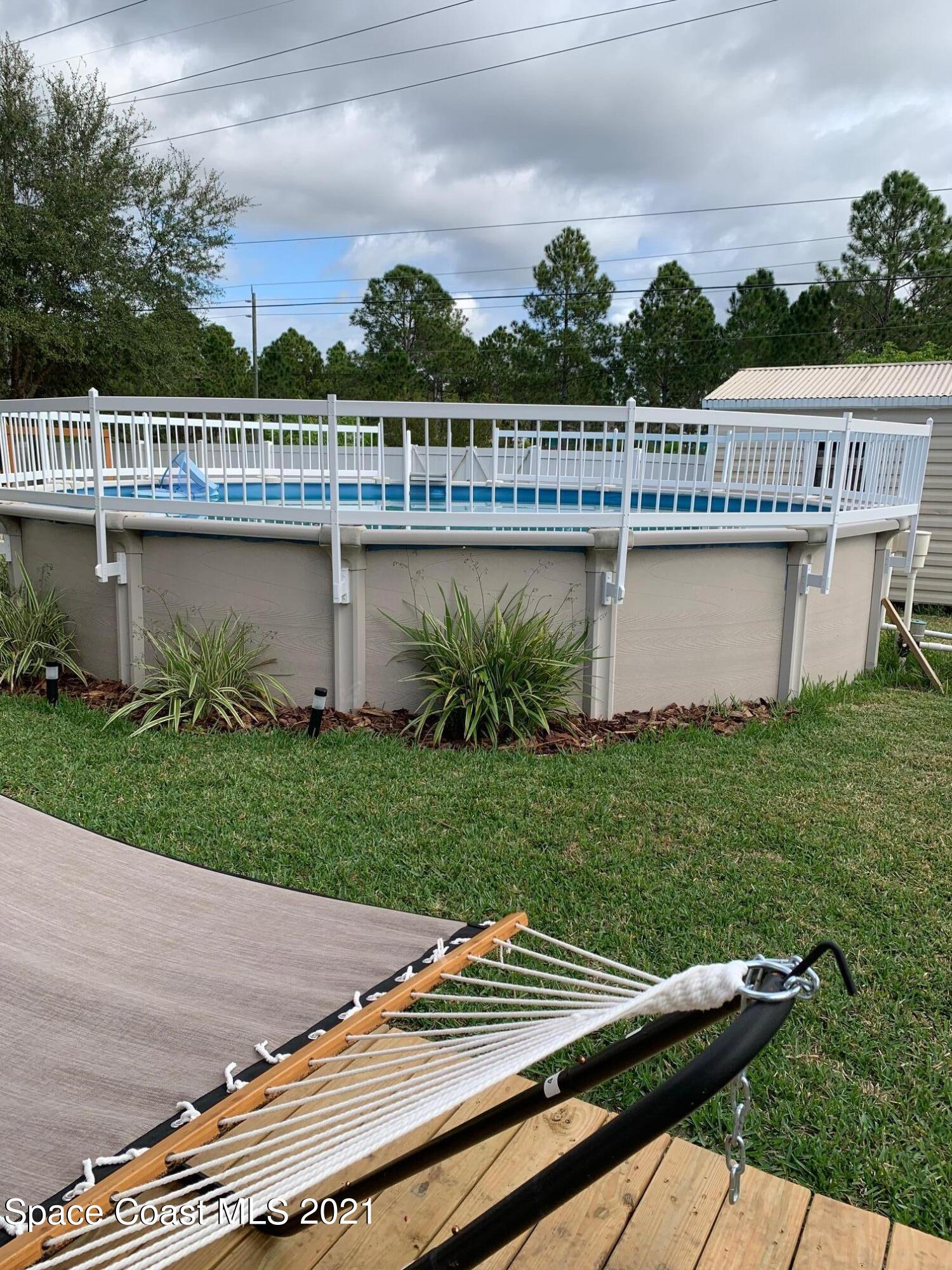 1277 Harlingen Road Southwest Palm Bay, FL 32908 - Photo 30 of 32 a view of outdoor space and yard