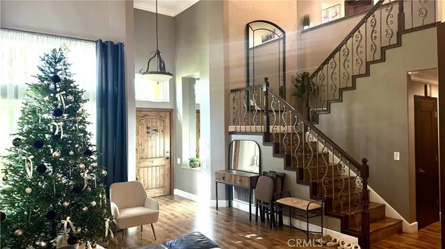 a view of entryway livingroom and hall with wooden floor