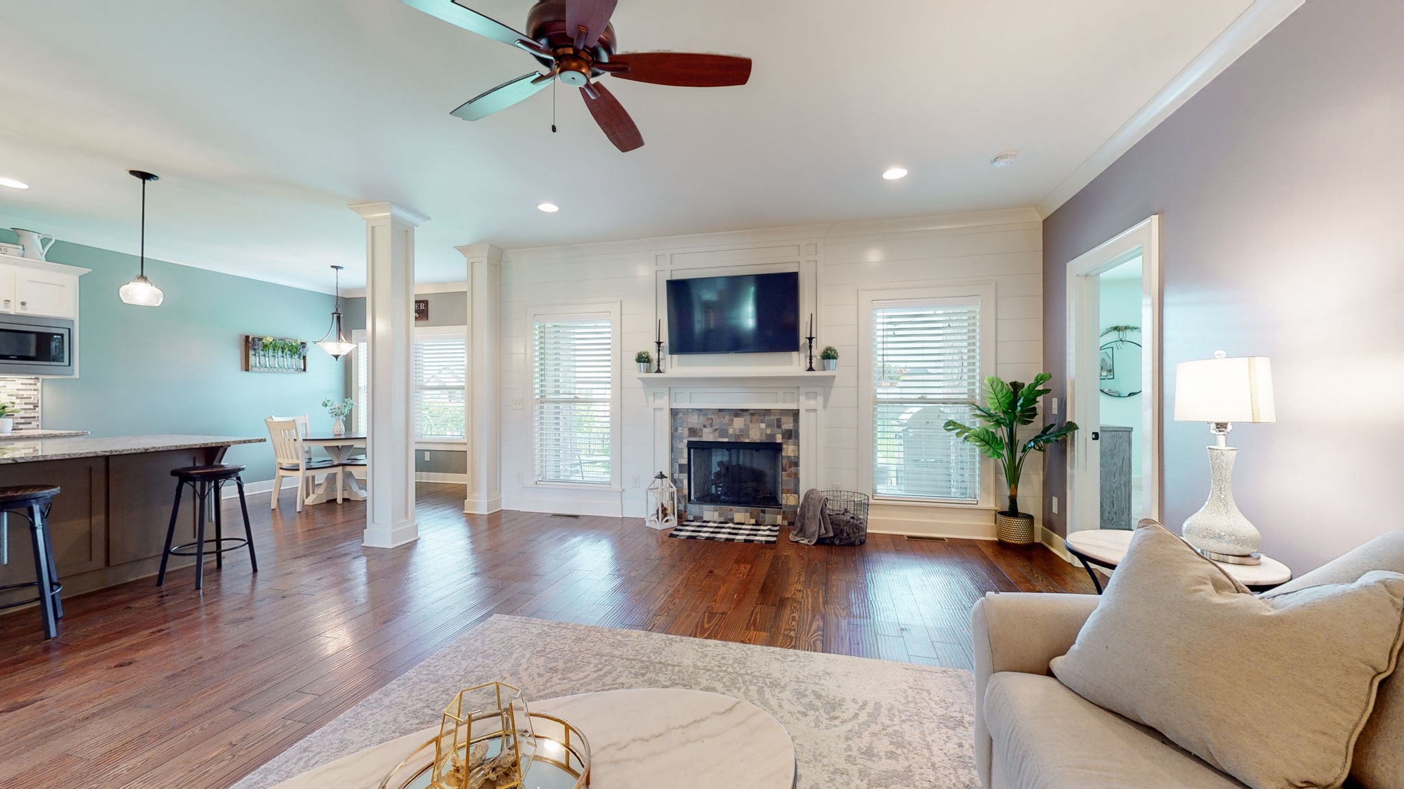 4017 Merryman Lane Murfreesboro, TN 37127 - Photo 12 of 62 a living room with furniture a fireplace and a flat screen tv