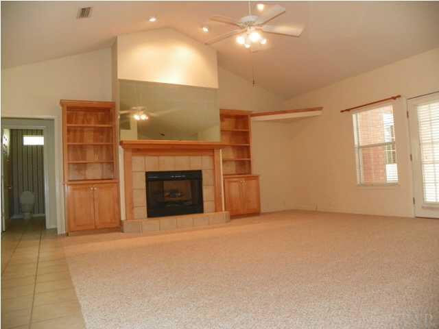 10066 Rookery Road Pensacola, FL 32507 - Photo 4 of 24 Great room with built ins and french doors leading to covered swimming pool