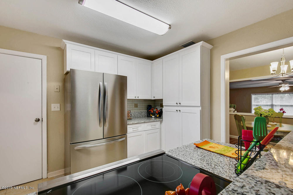 1175 Nightingale Road Jacksonville, FL 32216 - Photo 11 of 35 a refrigerator freezer sitting inside of a kitchen