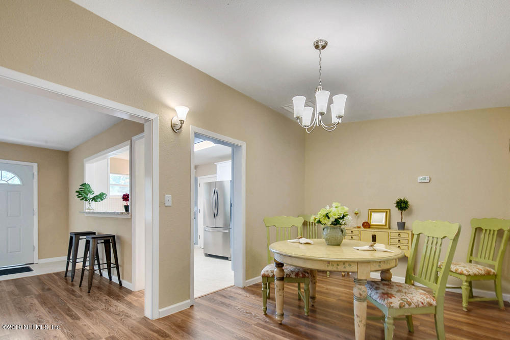 1175 Nightingale Road Jacksonville, FL 32216 - Photo 35 of 35 a view of a dining room with furniture and wooden floor
