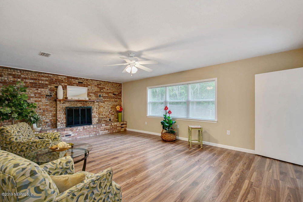1175 Nightingale Road Jacksonville, FL 32216 - Photo 13 of 35 a view of livingroom with furniture fireplace and window