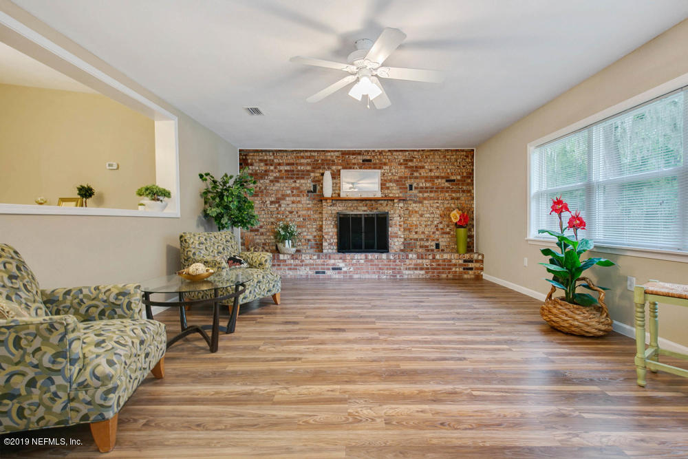 1175 Nightingale Road Jacksonville, FL 32216 - Photo 14 of 35 a living room with furniture and a fireplace
