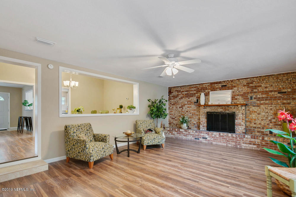 1175 Nightingale Road Jacksonville, FL 32216 - Photo 15 of 35 a living room with furniture and a fireplace