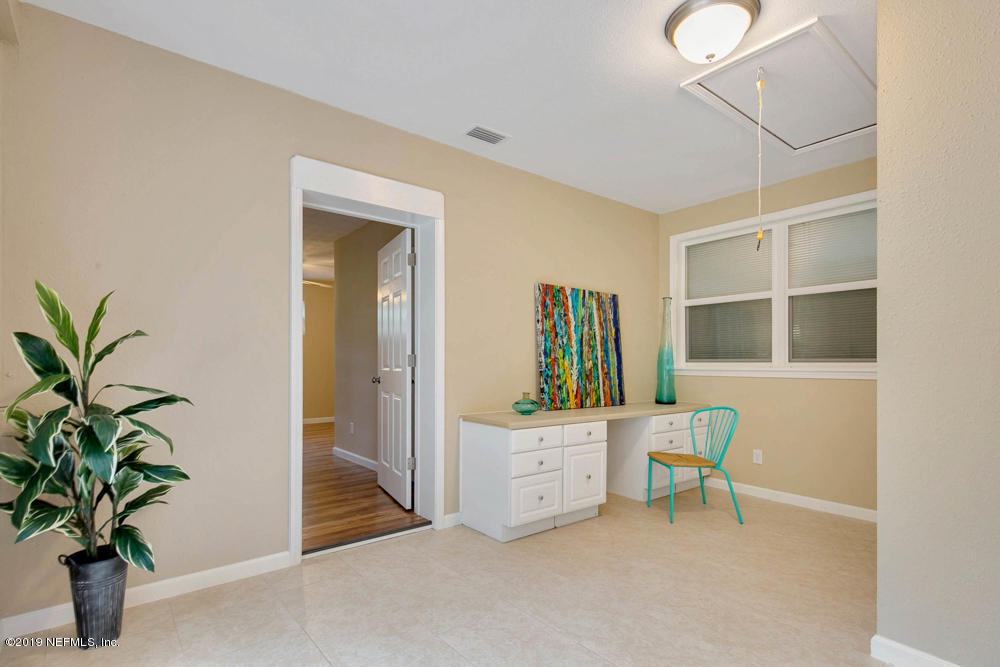 1175 Nightingale Road Jacksonville, FL 32216 - Photo 17 of 35 a workspace room with furniture and a potted plant