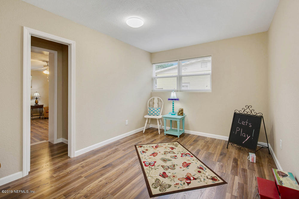 1175 Nightingale Road Jacksonville, FL 32216 - Photo 24 of 35 an empty room with furniture and wooden floor