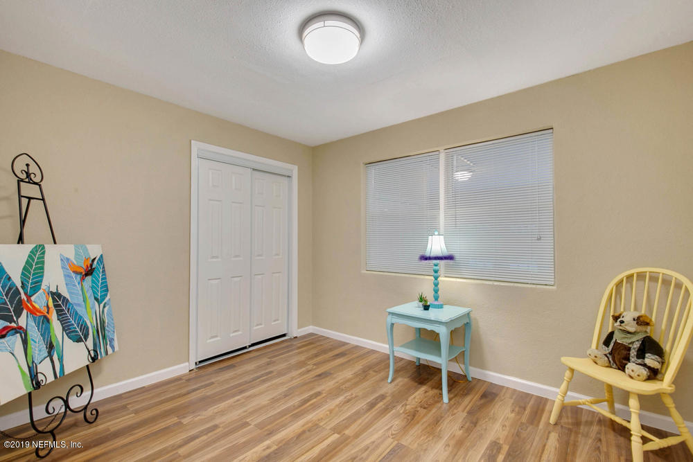 1175 Nightingale Road Jacksonville, FL 32216 - Photo 25 of 35 a living room with furniture and a wooden floor