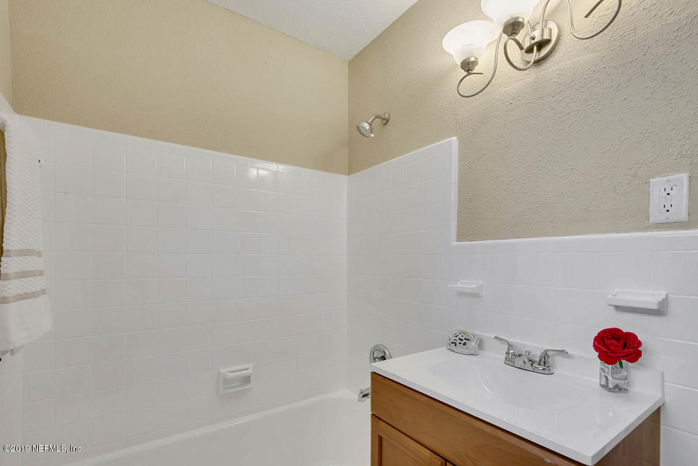1175 Nightingale Road Jacksonville, FL 32216 - Photo 26 of 35 a bathroom with a sink and a shower