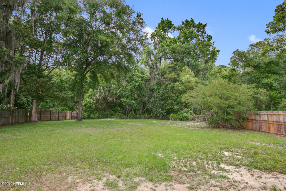 1175 Nightingale Road Jacksonville, FL 32216 - Photo 30 of 35 a view of a yard with a tree