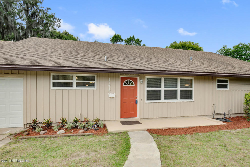 1175 Nightingale Road Jacksonville, FL 32216 - Photo 5 of 35 a front view of a house with a yard