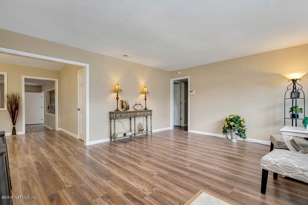 1175 Nightingale Road Jacksonville, FL 32216 - Photo 6 of 35 a view of a livingroom with furniture and wooden floor
