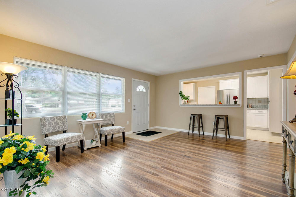 1175 Nightingale Road Jacksonville, FL 32216 - Photo 7 of 35 a living room with furniture and a wooden floor