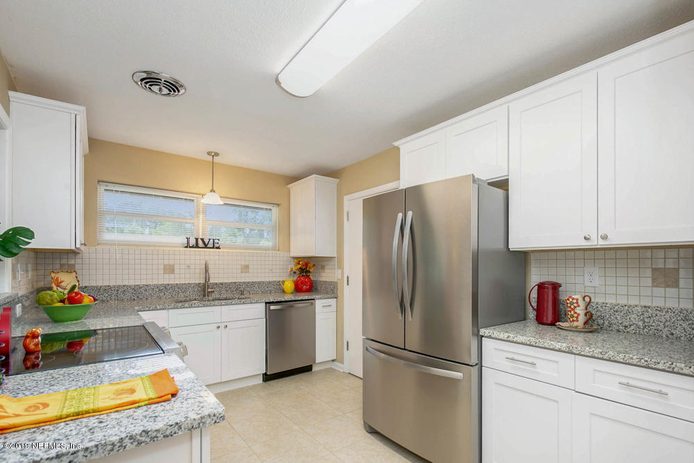 1175 Nightingale Road Jacksonville, FL 32216 - Photo 8 of 35 a kitchen with stainless steel appliances granite countertop a refrigerator sink and cabinets