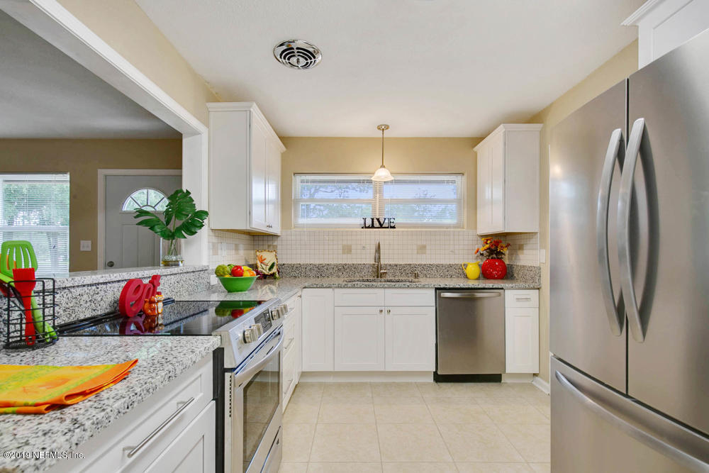 1175 Nightingale Road Jacksonville, FL 32216 - Photo 9 of 35 a kitchen with a sink dishwasher a refrigerator and a stove
