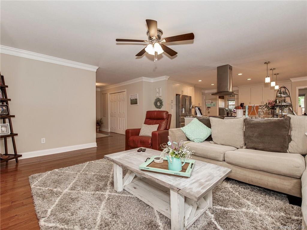 4109 Lake Shore Road South Denver, NC 28037 - Photo 8 of 31 a living room with furniture and a wooden floor