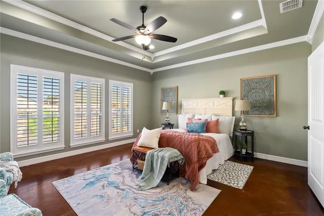 a bed room with a bed and a chandelier