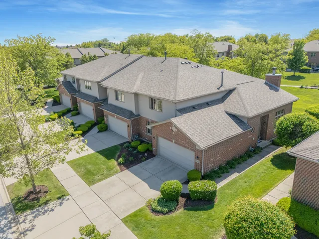an aerial view of a house with a garden
