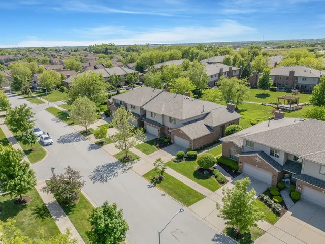 an aerial view of a house with a lake view