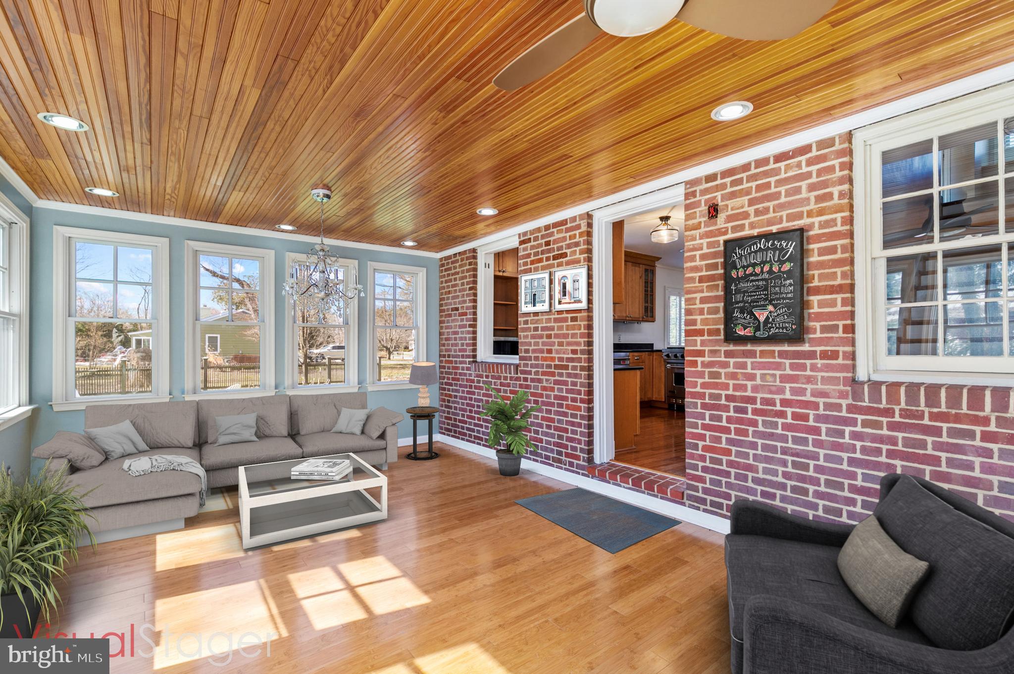 727 Whitehall Beach Road Annapolis, MD 21409 - Photo 13 of 44 a balcony with furniture and large windows
