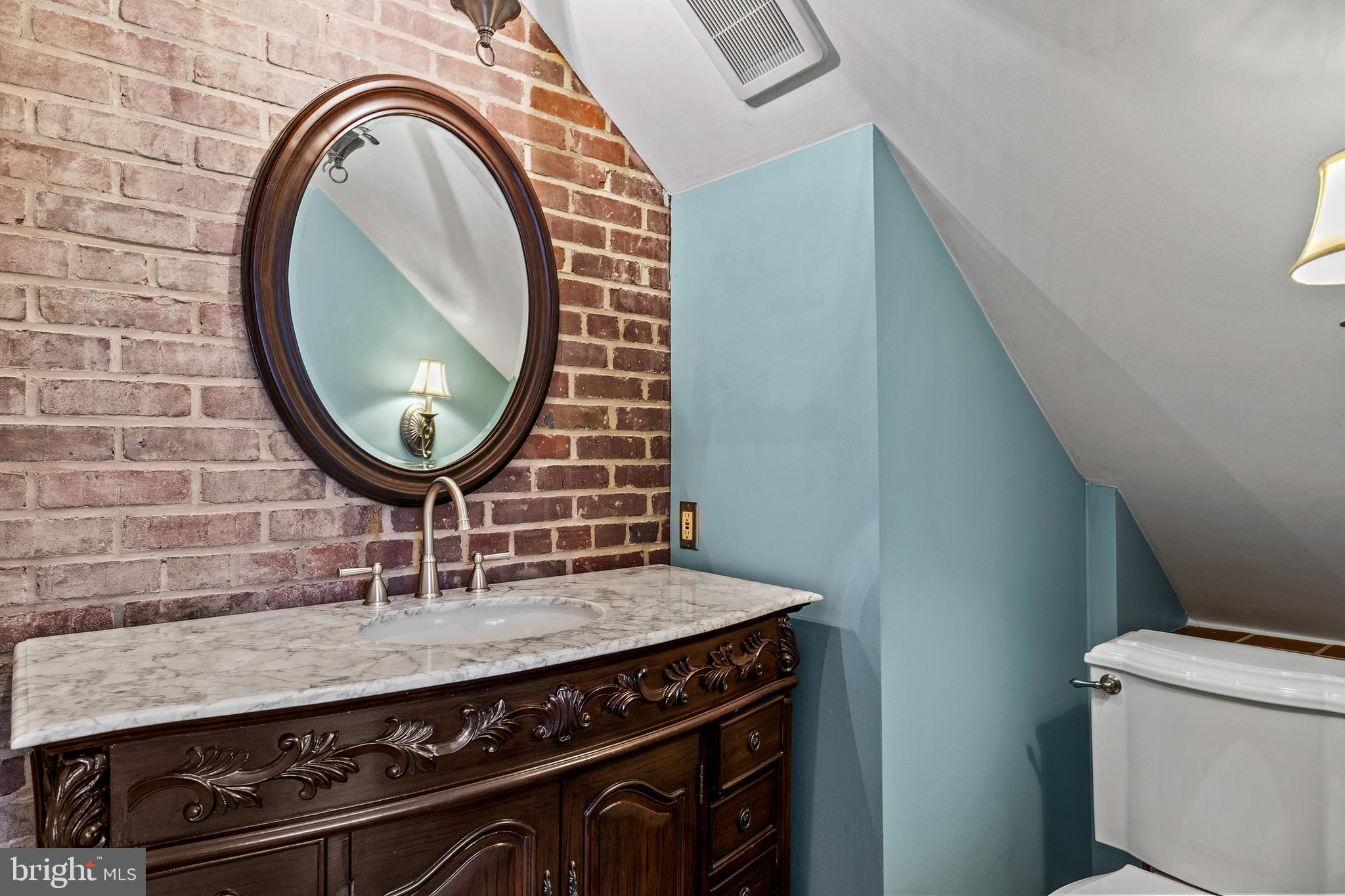 727 Whitehall Beach Road Annapolis, MD 21409 - Photo 15 of 44 a kitchen with a stove and a mirror