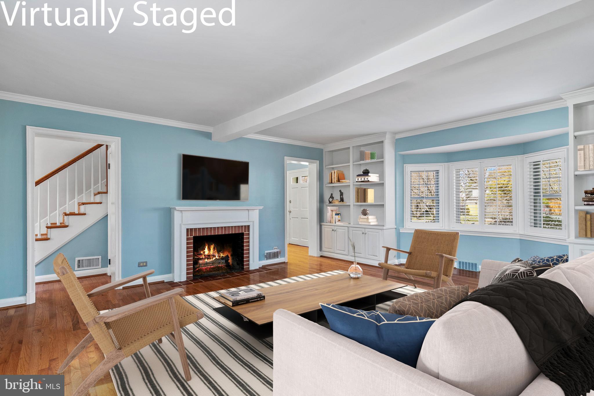 727 Whitehall Beach Road Annapolis, MD 21409 - Photo 16 of 44 a living room with furniture fireplace and flat screen tv