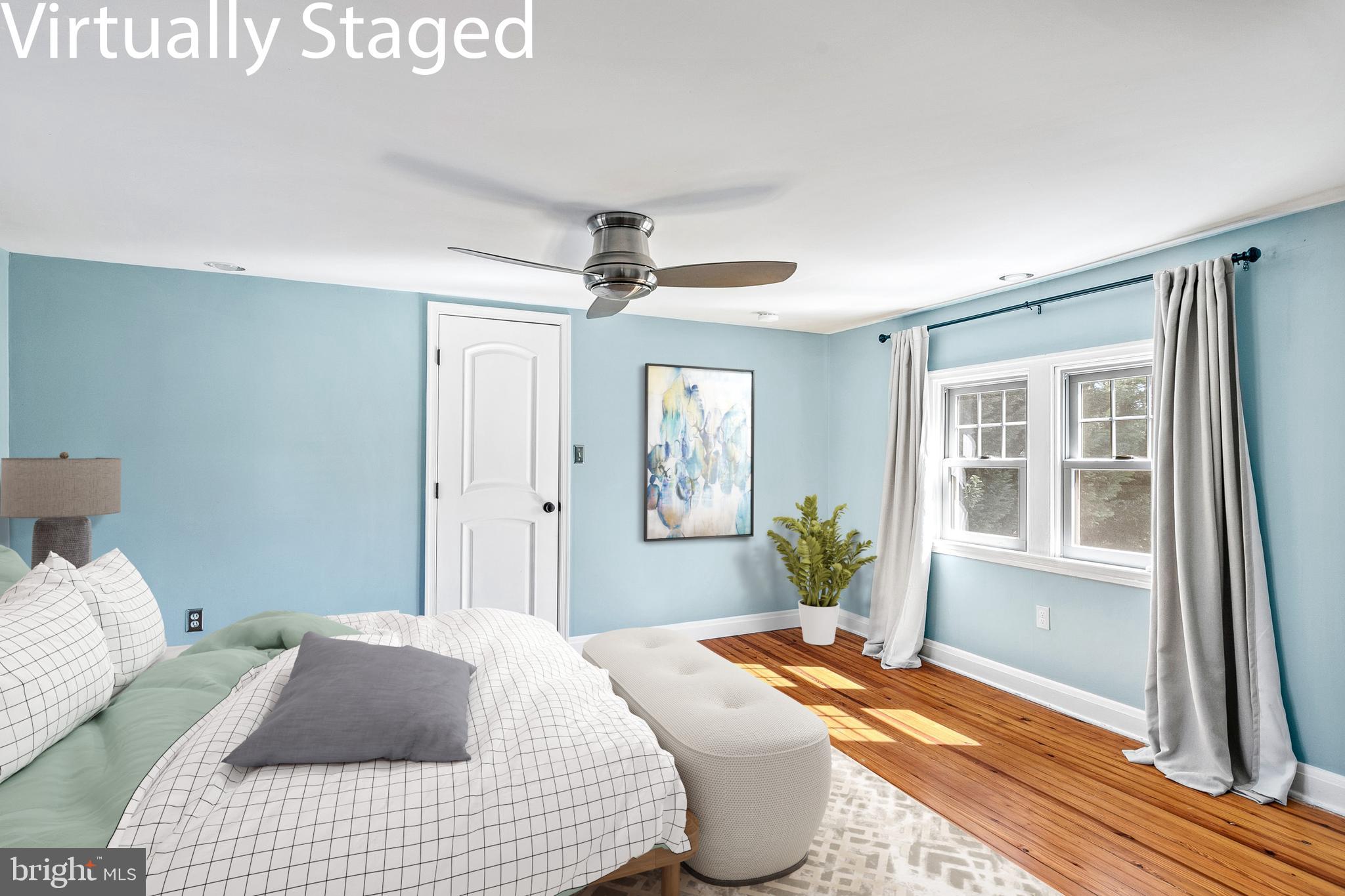 727 Whitehall Beach Road Annapolis, MD 21409 - Photo 21 of 44 a bedroom with a bed dresser and a window