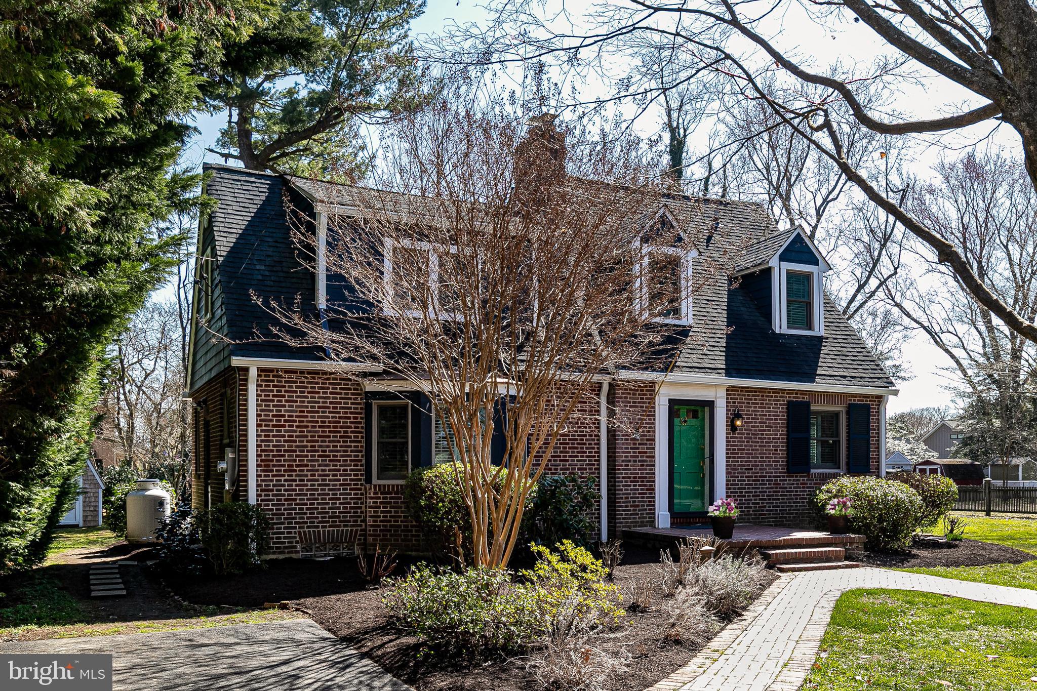 727 Whitehall Beach Road Annapolis, MD 21409 - Photo 28 of 44 a front view of a house with garden