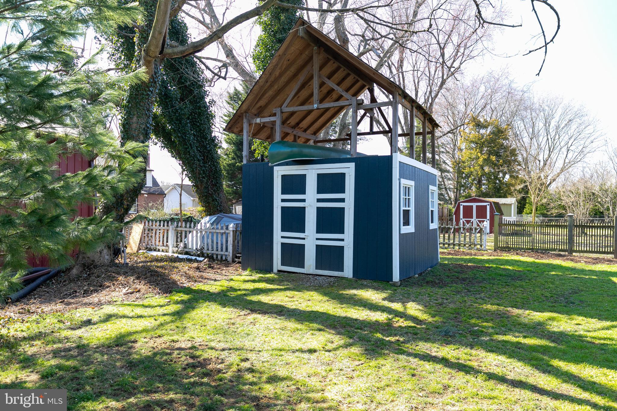 727 Whitehall Beach Road Annapolis, MD 21409 - Photo 34 of 44 a view of a house with a yard and sitting area