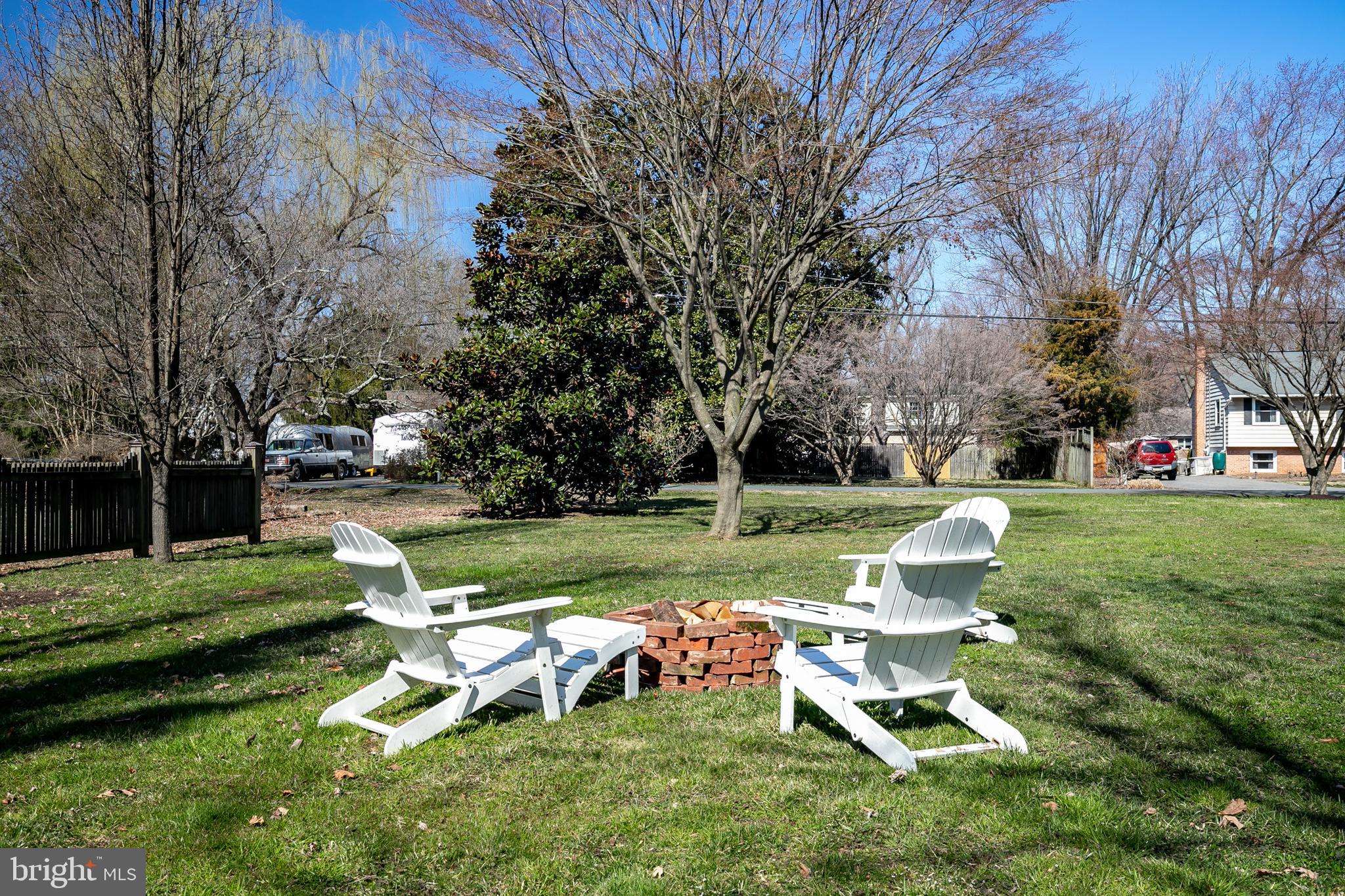 727 Whitehall Beach Road Annapolis, MD 21409 - Photo 35 of 44 a view of a table and chairs in the garden