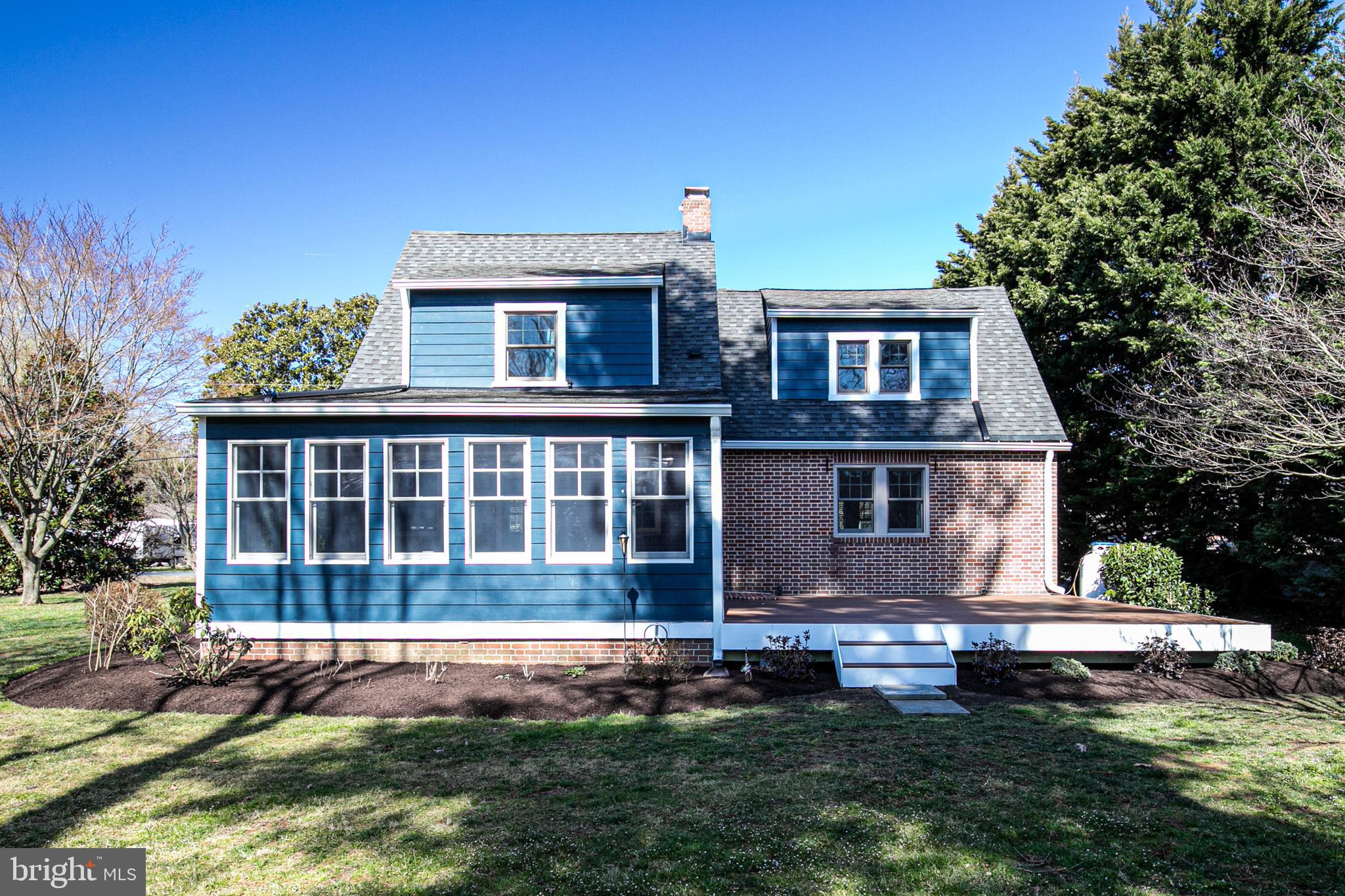 727 Whitehall Beach Road Annapolis, MD 21409 - Photo 37 of 44 a front view of a house with a yard