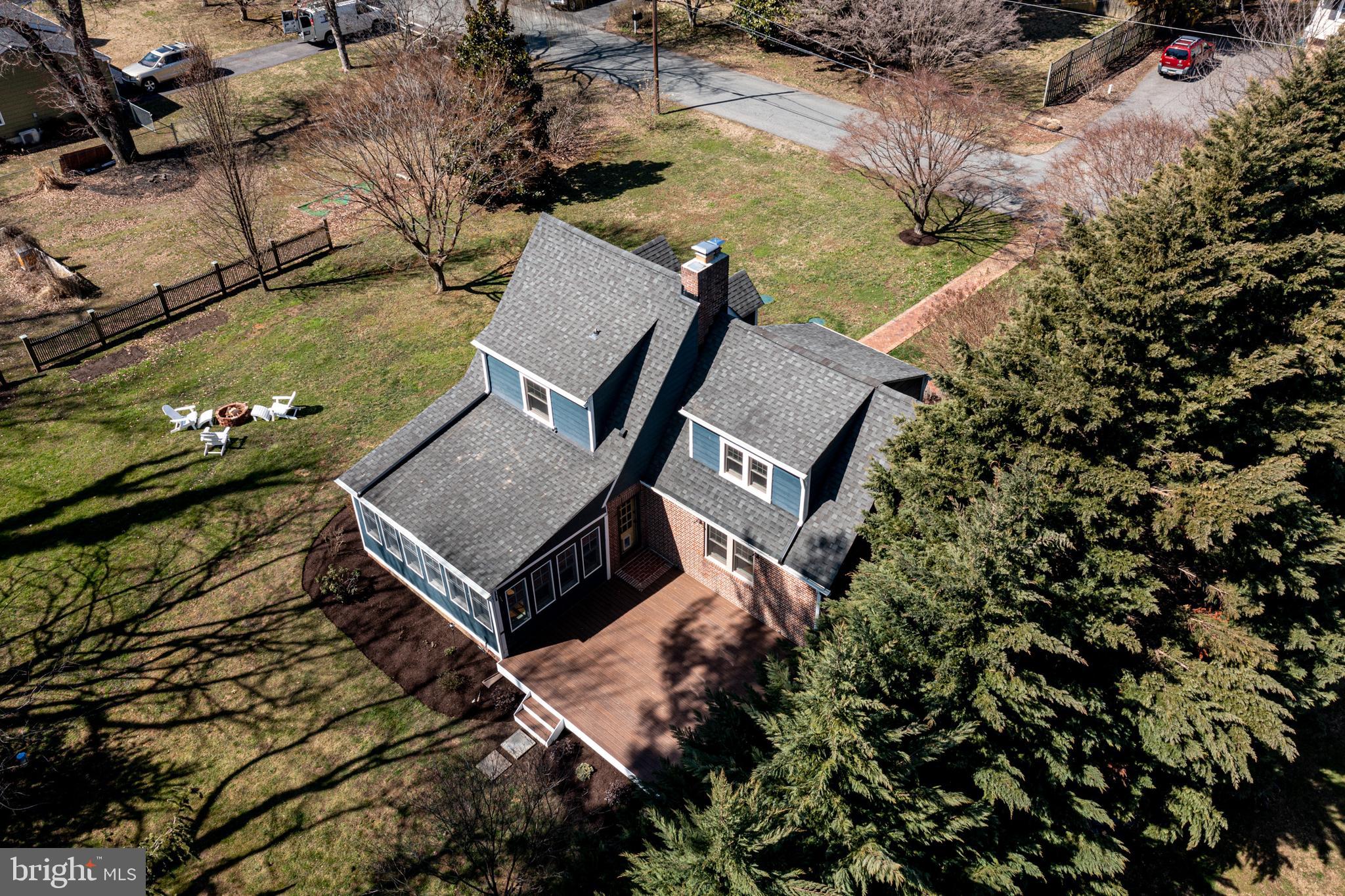 727 Whitehall Beach Road Annapolis, MD 21409 - Photo 4 of 44 an aerial view of a house with a yard