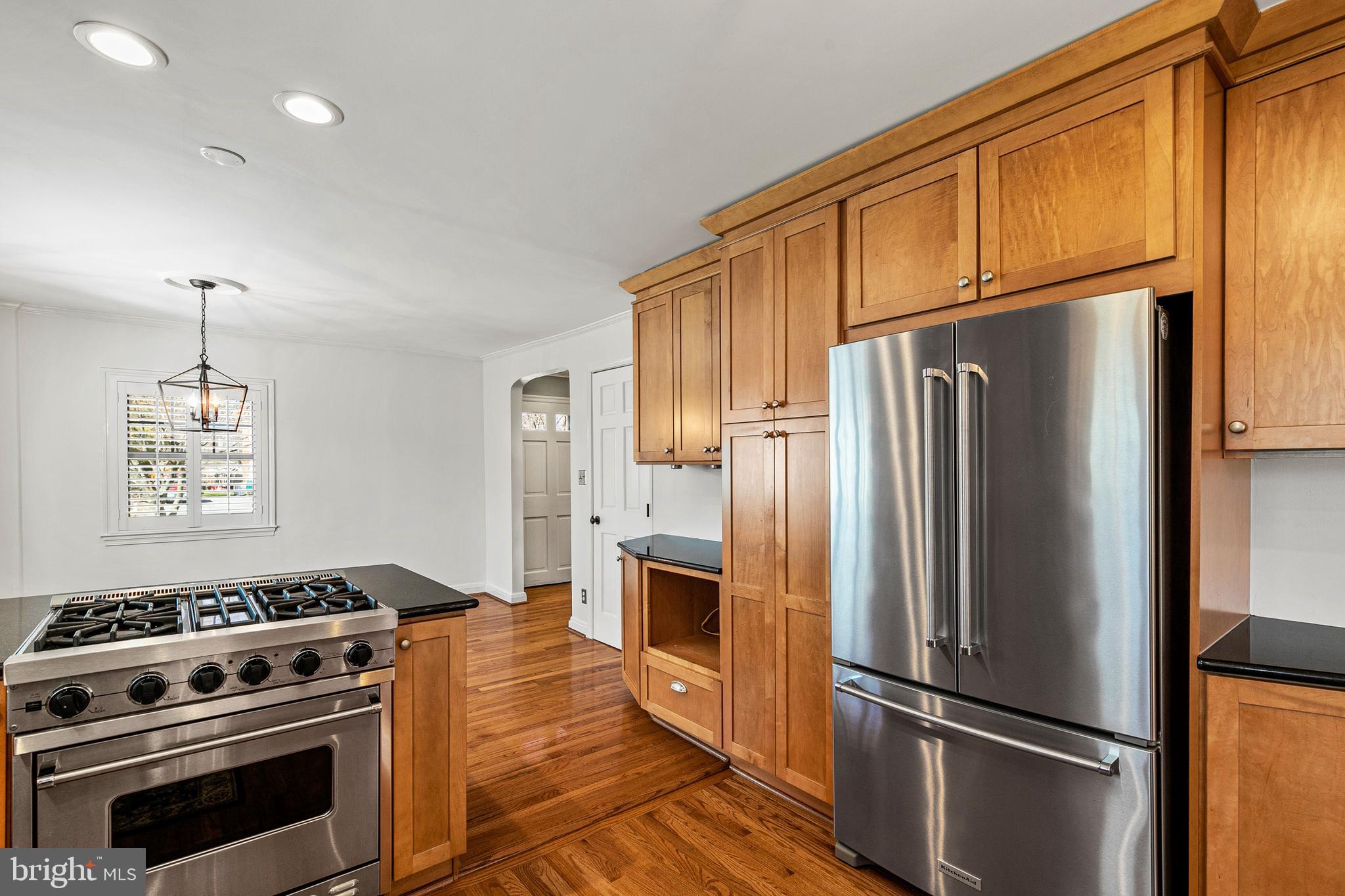 727 Whitehall Beach Road Annapolis, MD 21409 - Photo 7 of 44 a kitchen with stainless steel appliances a refrigerator stove and microwave