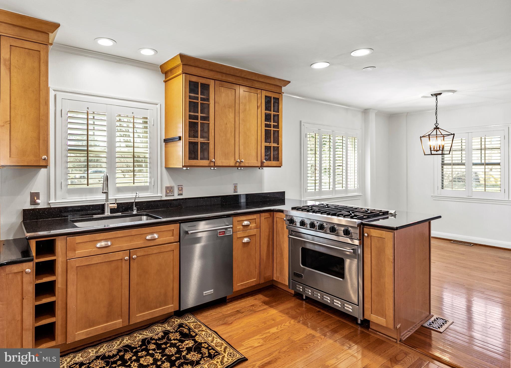 727 Whitehall Beach Road Annapolis, MD 21409 - Photo 8 of 44 a kitchen with granite countertop a stove sink and microwave