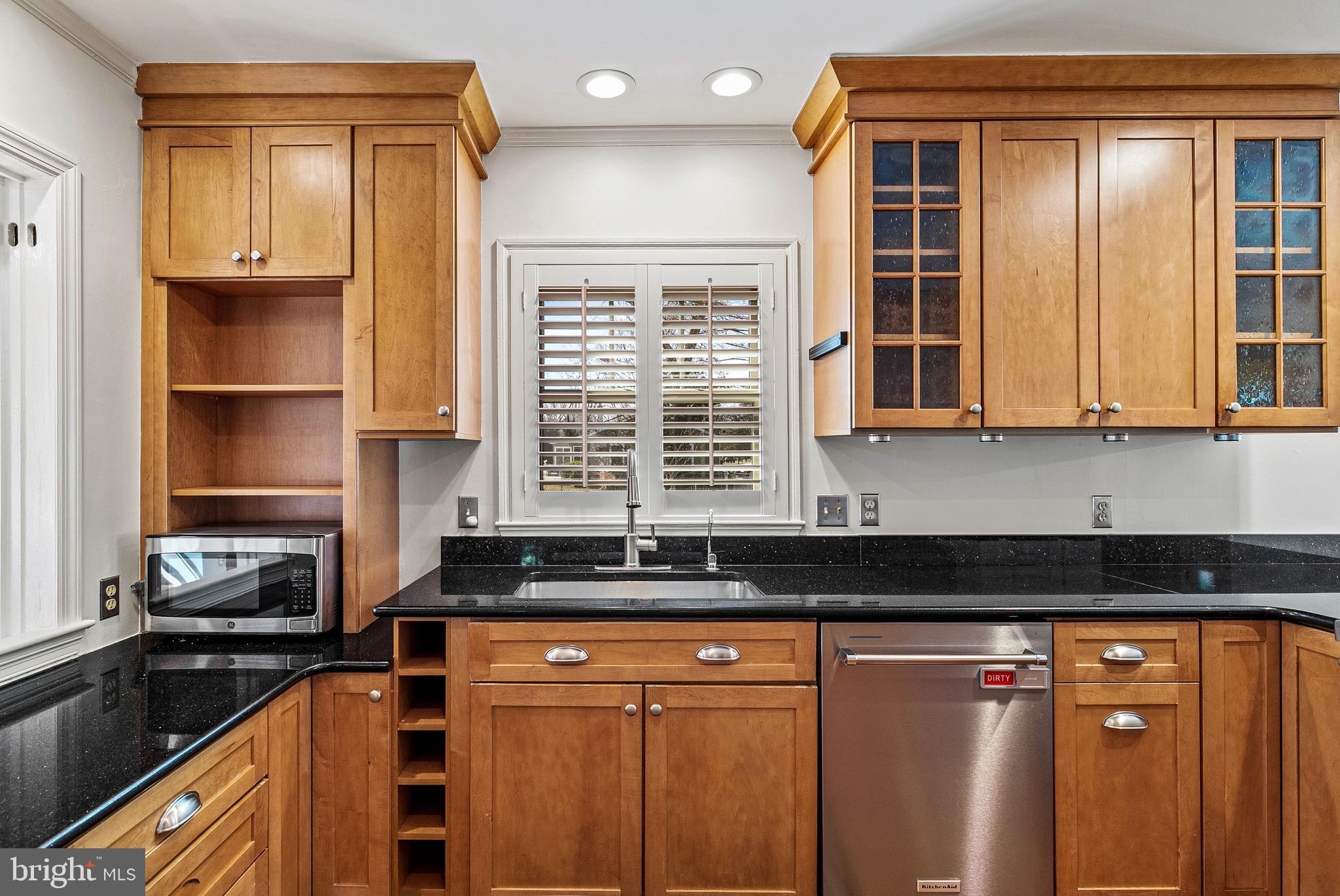 727 Whitehall Beach Road Annapolis, MD 21409 - Photo 9 of 44 a kitchen with stainless steel appliances granite countertop a stove a sink and a microwave