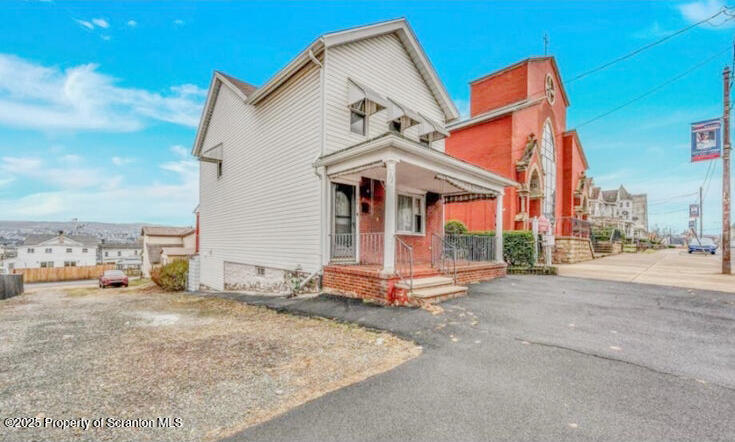 209 South Main Avenue Scranton, PA 18504 - Photo 1 of 21 a view of a house with a patio