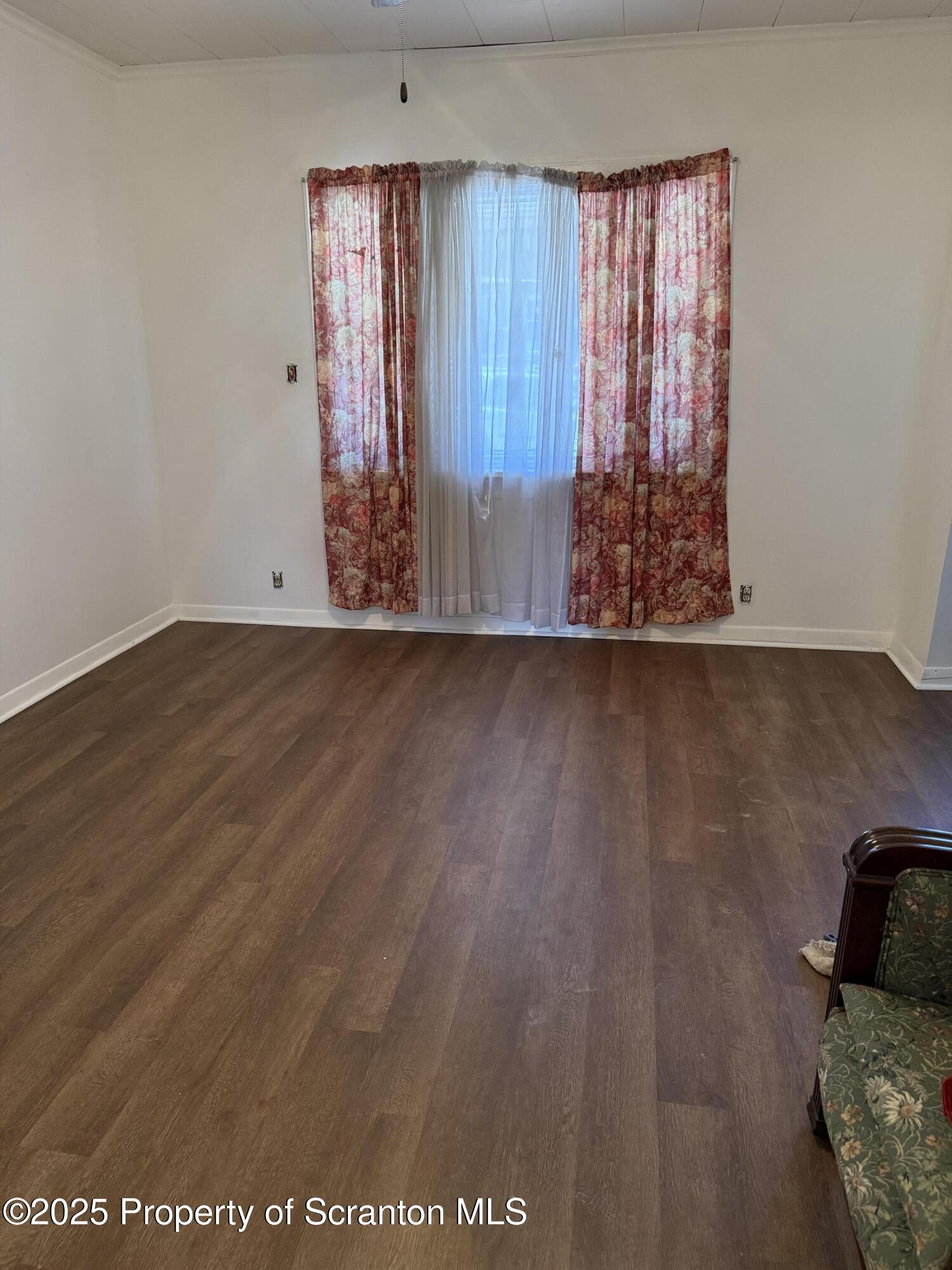 209 South Main Avenue Scranton, PA 18504 - Photo 16 of 21 an empty room with wooden floor and windows