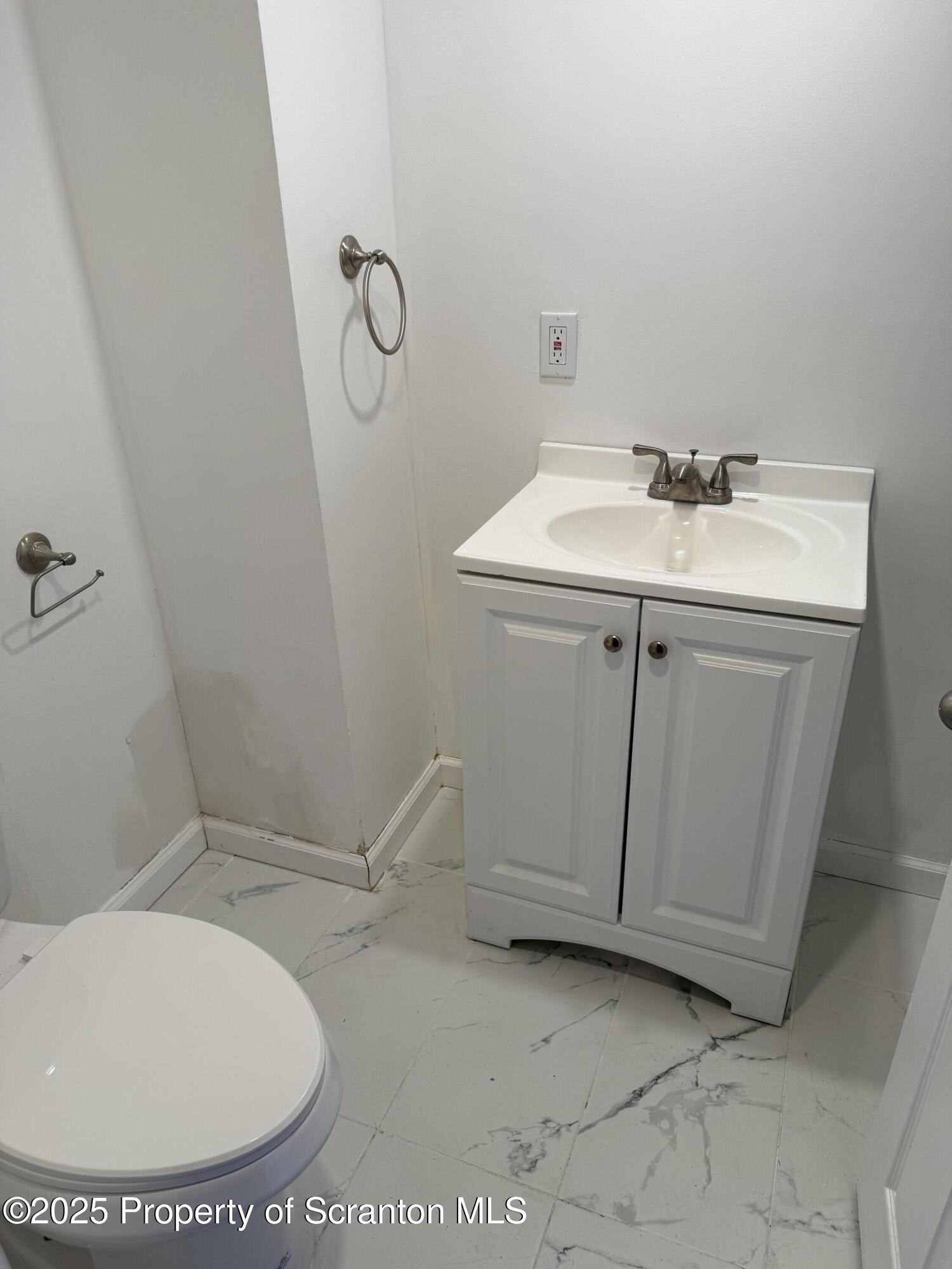 209 South Main Avenue Scranton, PA 18504 - Photo 18 of 21 a bathroom with a sink and a mirror