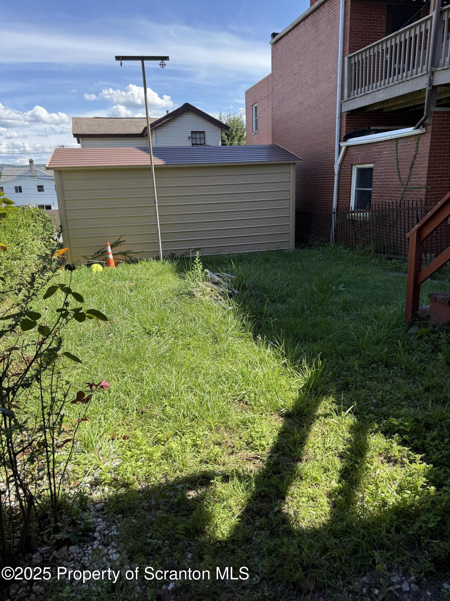 209 South Main Avenue Scranton, PA 18504 - Photo 20 of 21 a front view of a house with garden