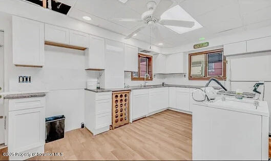 209 South Main Avenue Scranton, PA 18504 - Photo 6 of 21 a kitchen with stainless steel appliances granite countertop a sink stove and refrigerator