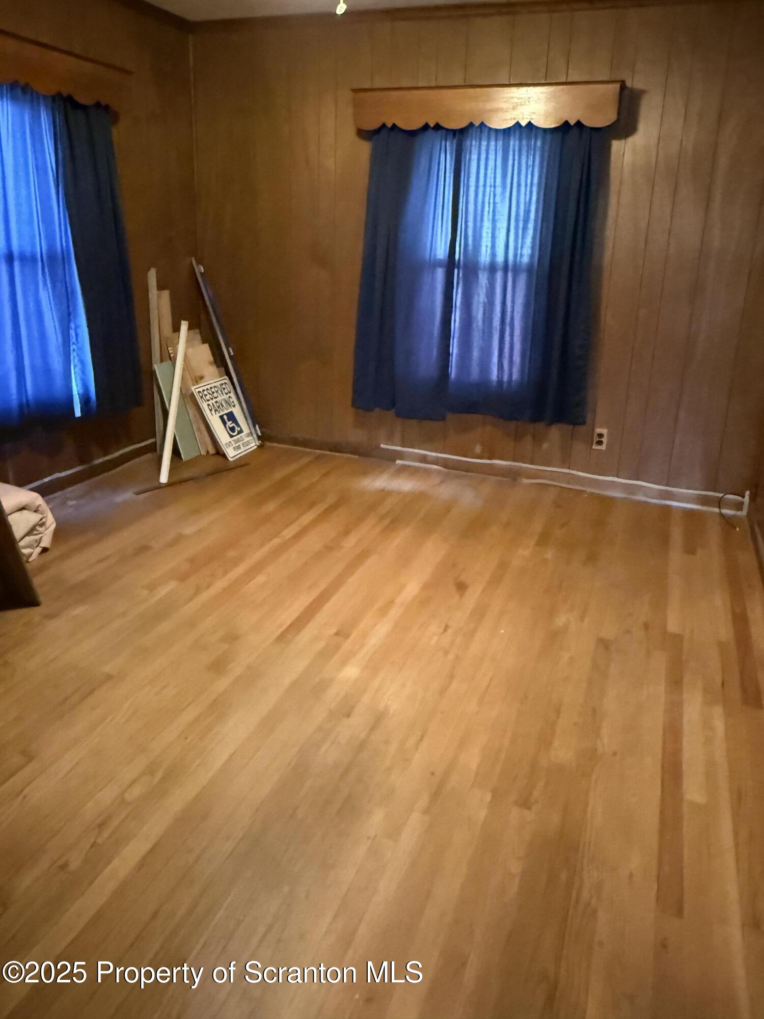 209 South Main Avenue Scranton, PA 18504 - Photo 10 of 21 a view of an empty room with wooden floor