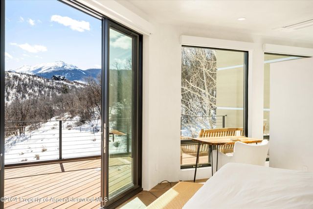 a view of a balcony with dining table